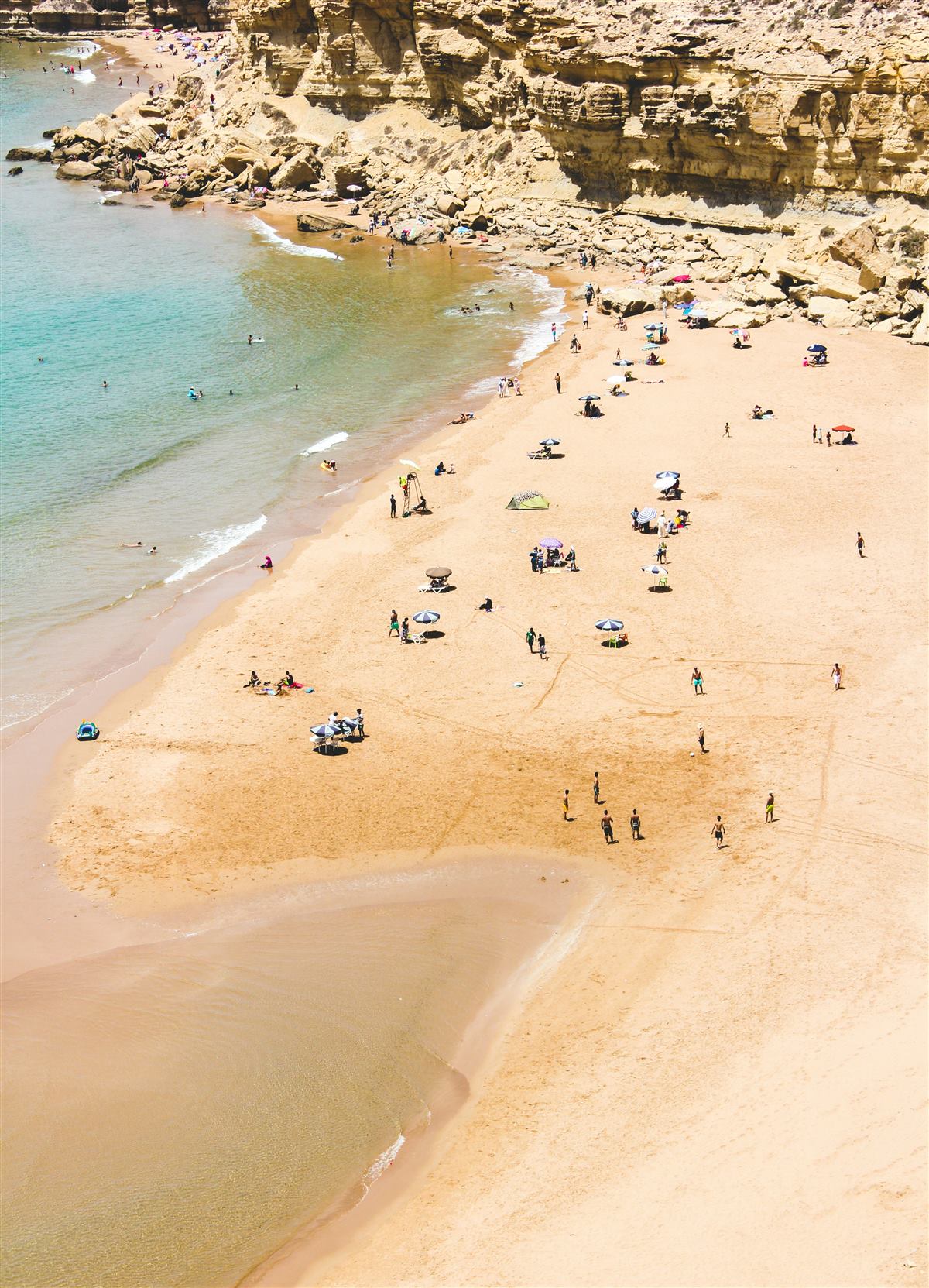 Sandy cove beneath cliffs on Morocco's southern Atlantic coast