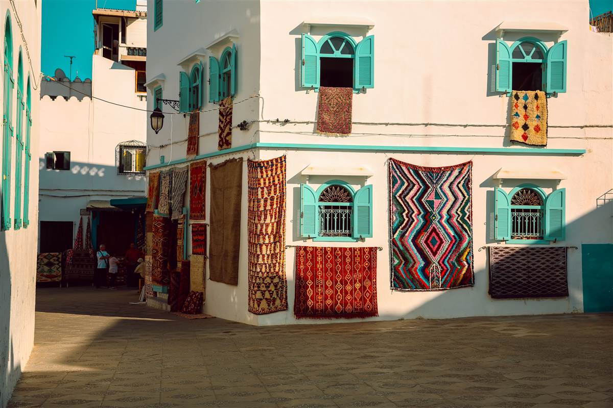 Asilah festival murals whitewashed medina lanes Morocco