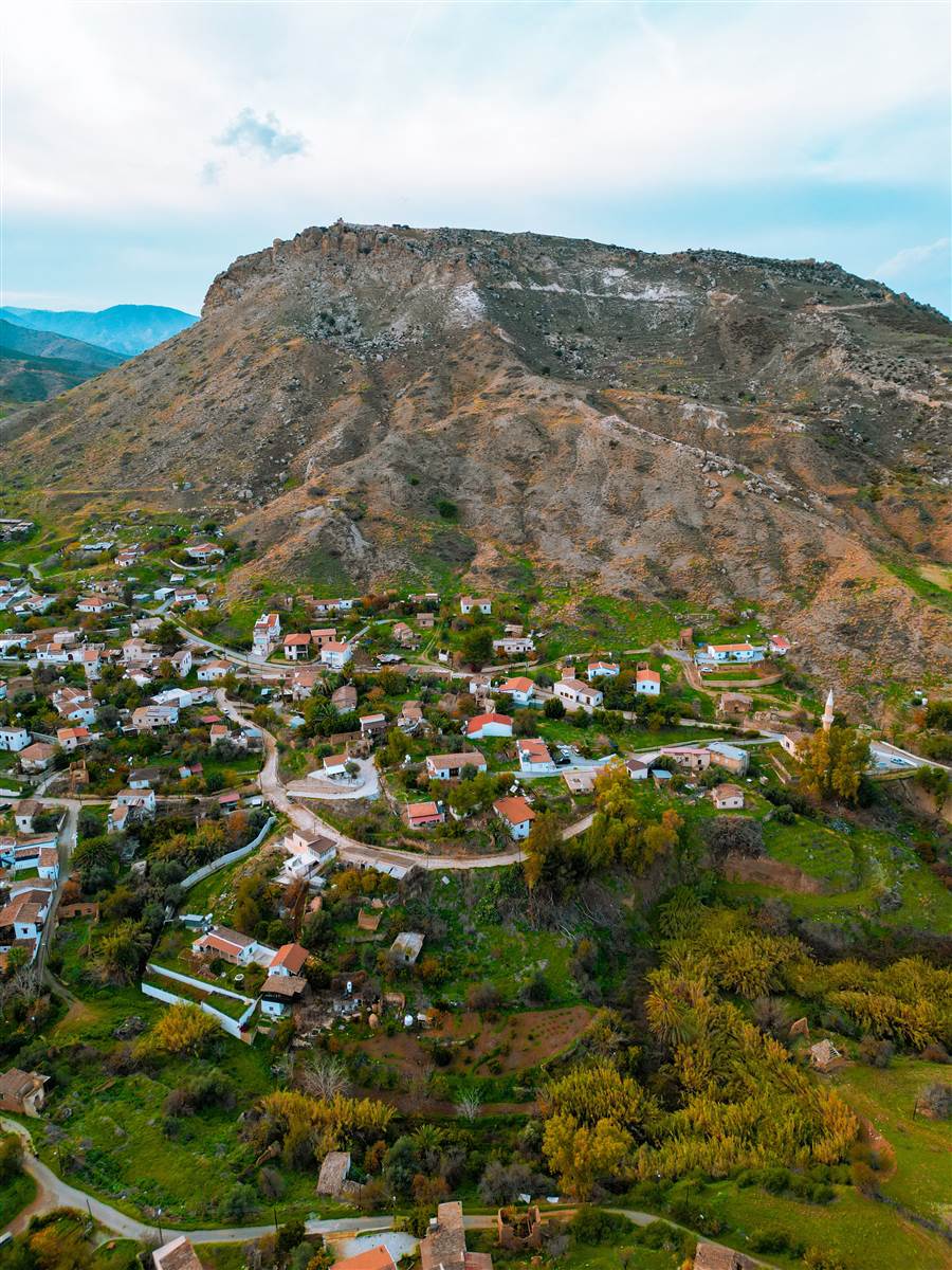 Azrou village beneath its volcanic rock peak, Middle Atlas Morocco