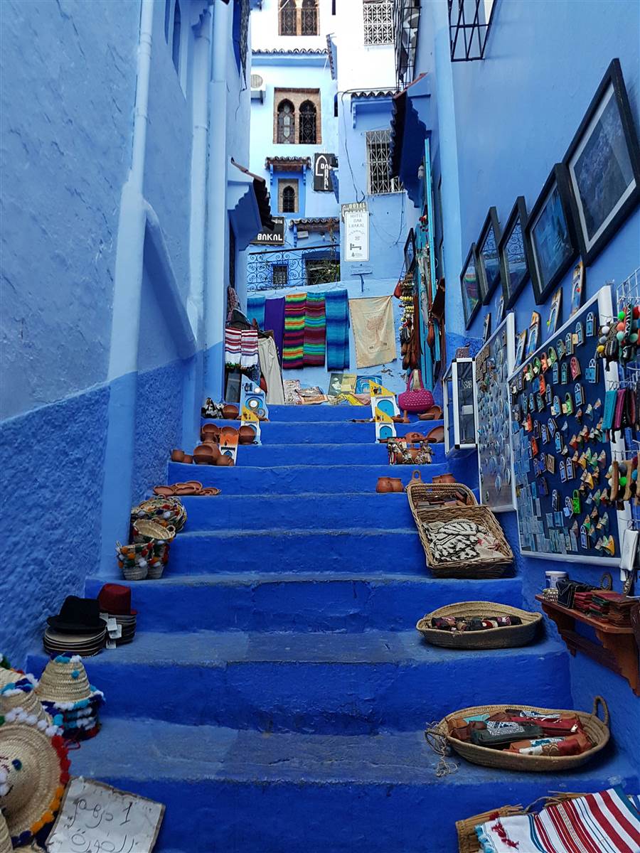 Blue stairs and craft shops in Chefchaouen Blue Pearl Morocco