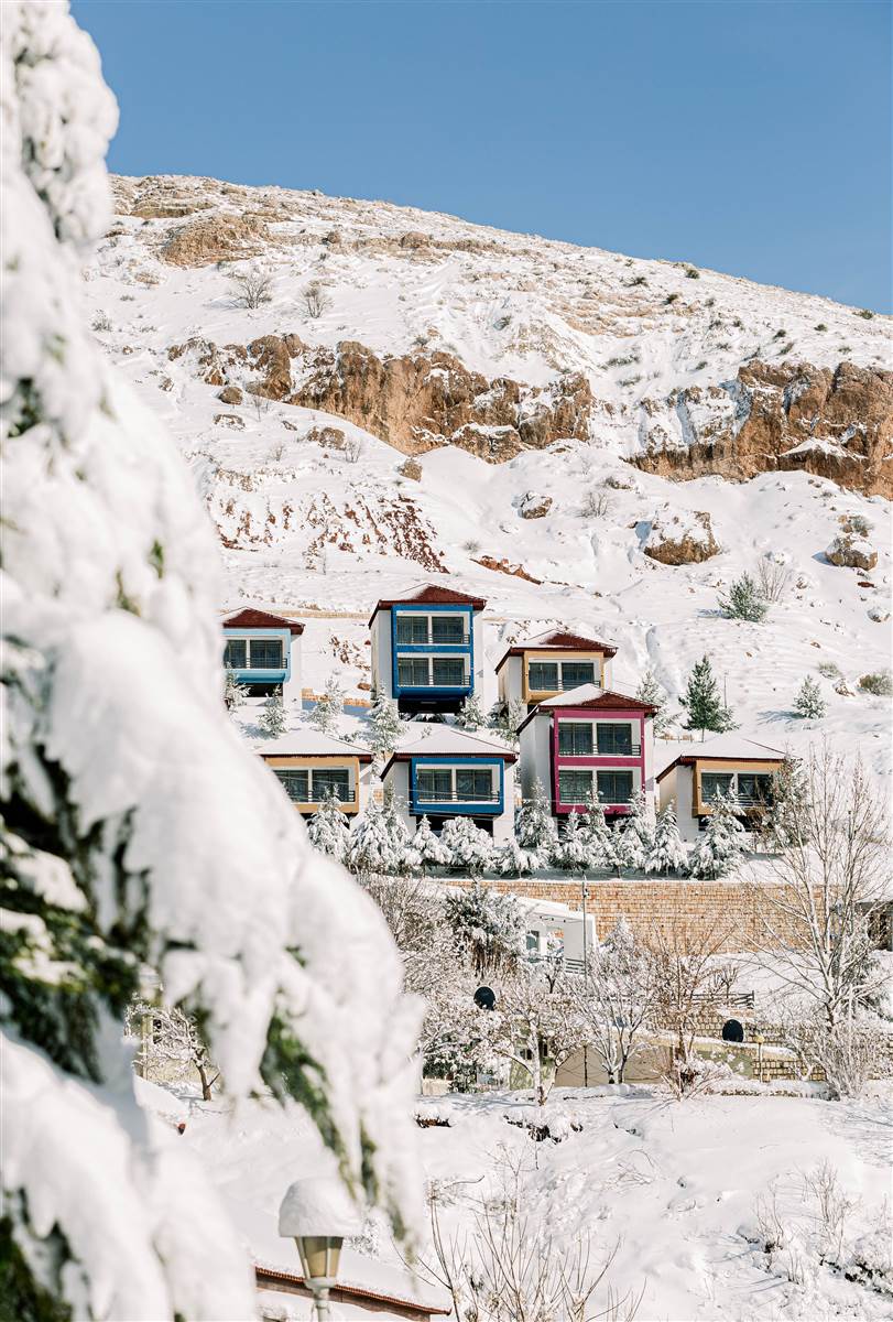 Colourful alpine chalets in snow at Ifrane, Middle Atlas Morocco