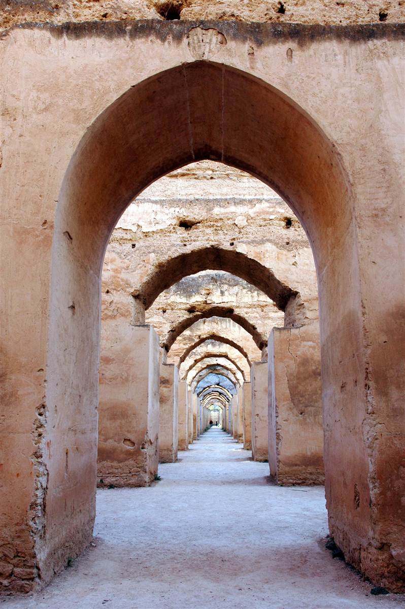 Vaulted arches corridor of Heri es-Souani granaries in Meknes Morocco