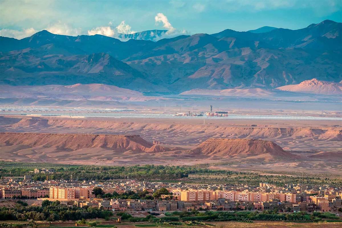 Ouarzazate city panorama with Atlas Mountains and solar plant Morocco